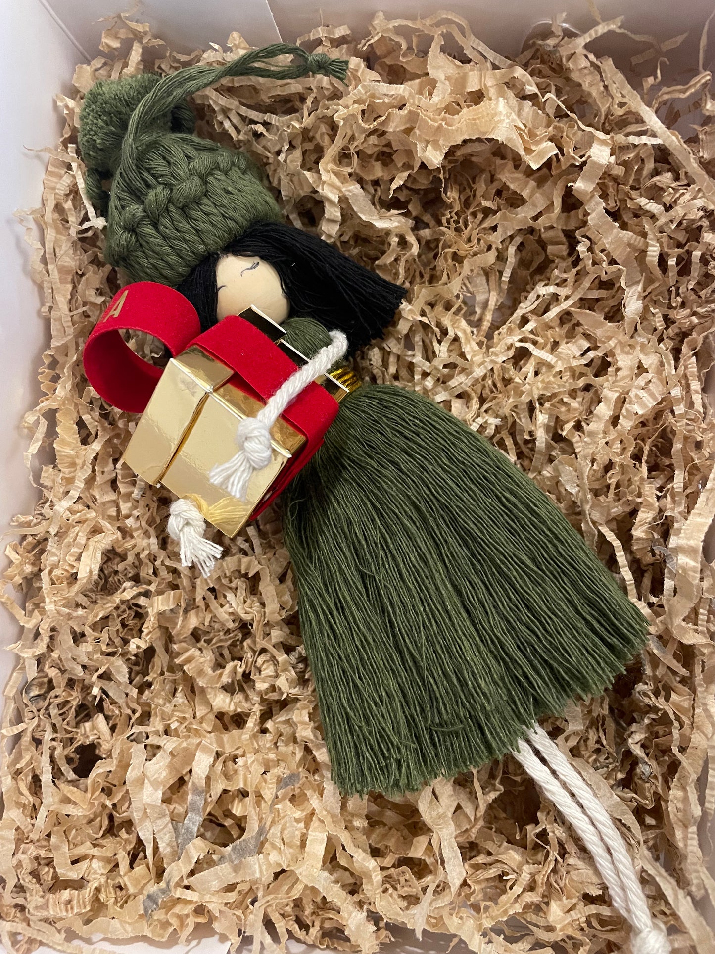 Macramé doll with gift