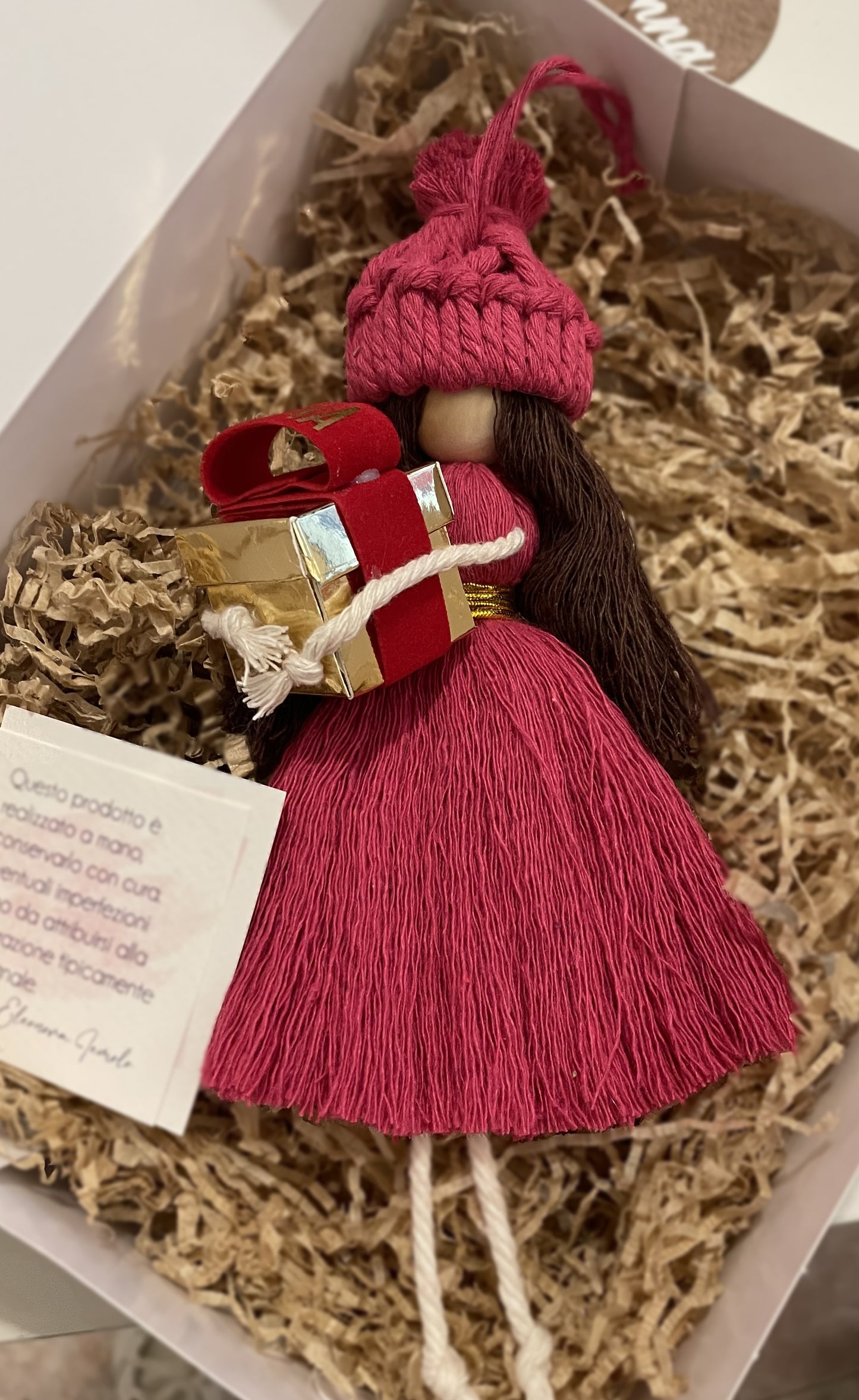 Macramé doll with gift