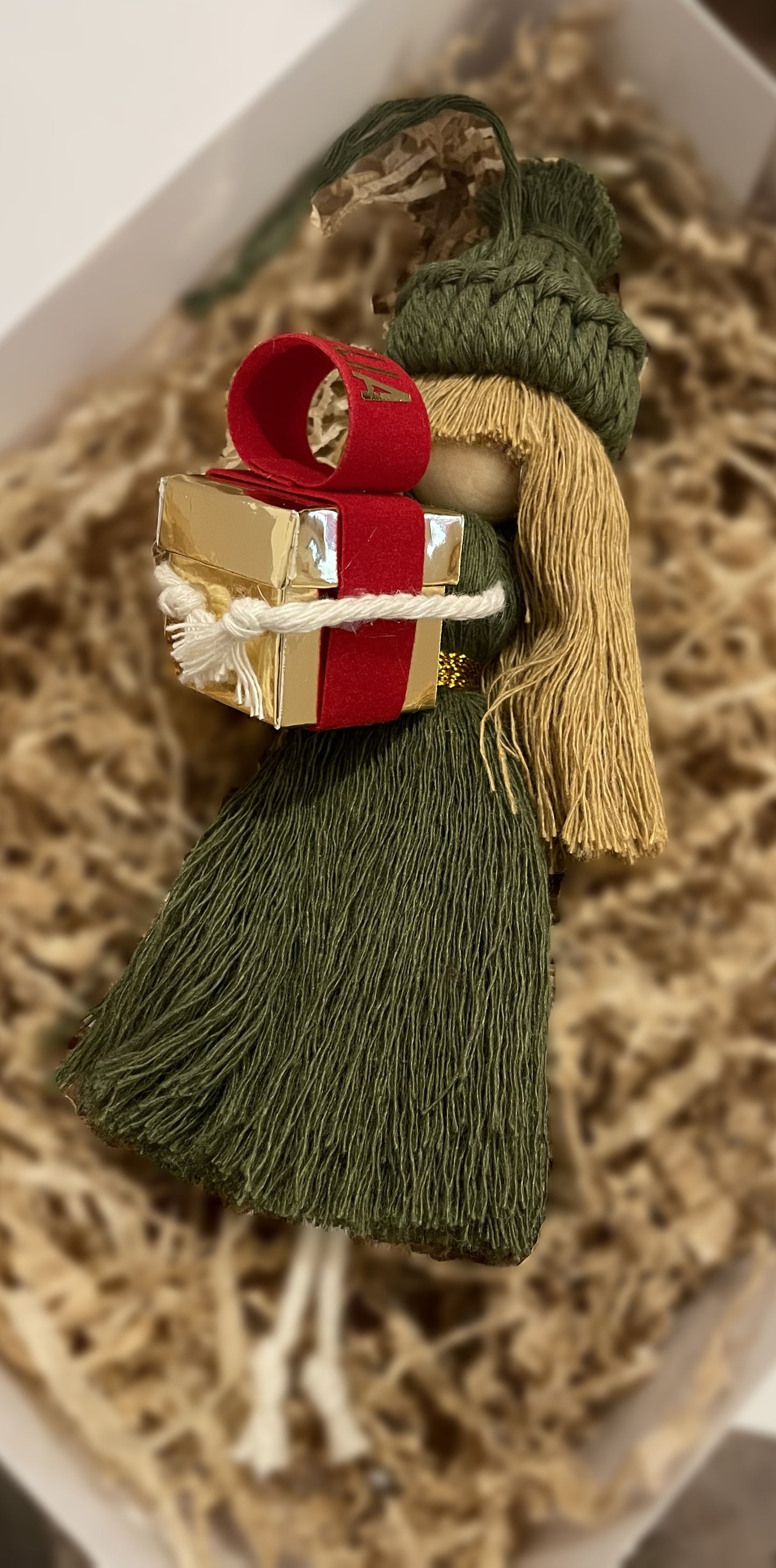 Macramé doll with gift