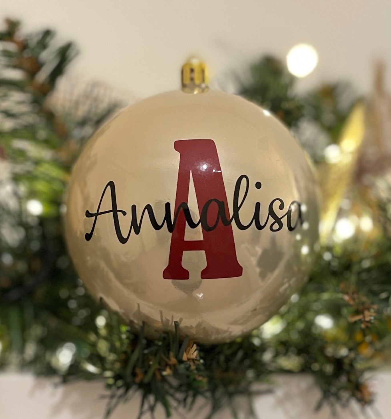 Colored plastic Christmas bauble with name